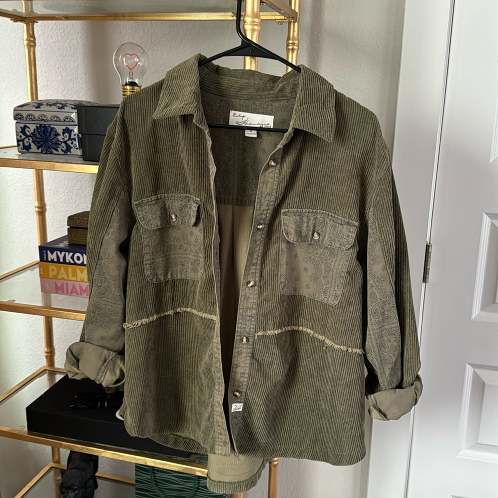 courdoroy green jacket with paisley details